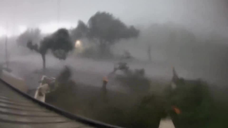 Watch as a tornado rips off treetops in Florida's St. Lucie county
