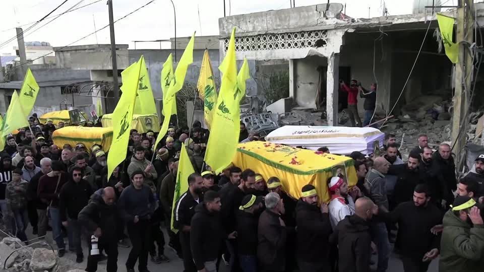 Hundreds of mourners attend funerals of Hezbollah fighters killed during hostilities in Maarakeh