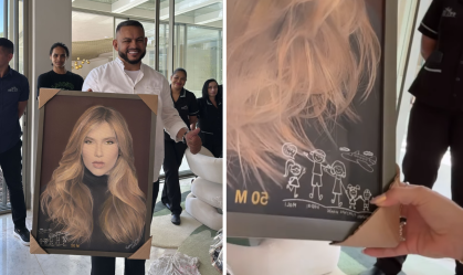 Virginia faz amigo secreto com seus funcionários e ganha quadro com seu rosto