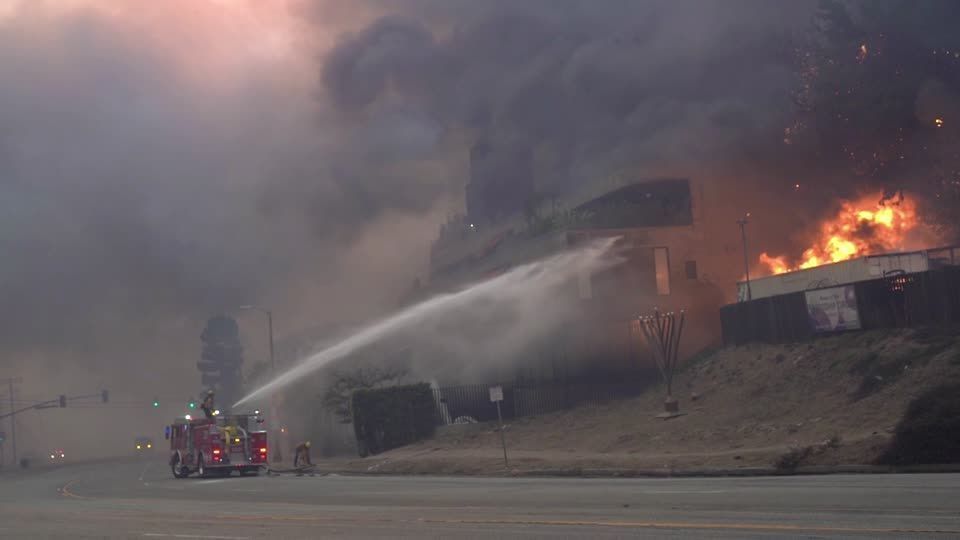 Raging Los Angeles wildfire engulfs upscale area, triggers evacuations