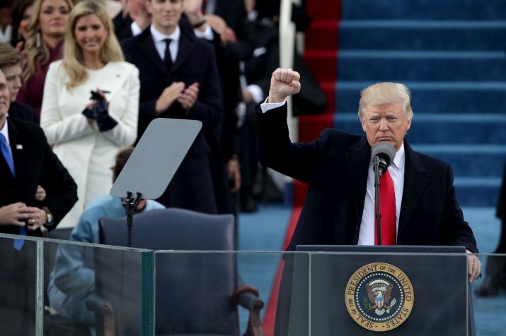 WASHINGTON, DC - JANUARY 20: President Donald Trump raises a fist after his inauguration on the West Front of the U.S. Capitol on January 20, 2017 in Washington, DC. In today's inauguration ceremony Donald J. Trump becomes the 45th president of the United States. • Alex Wong/Getty Images
