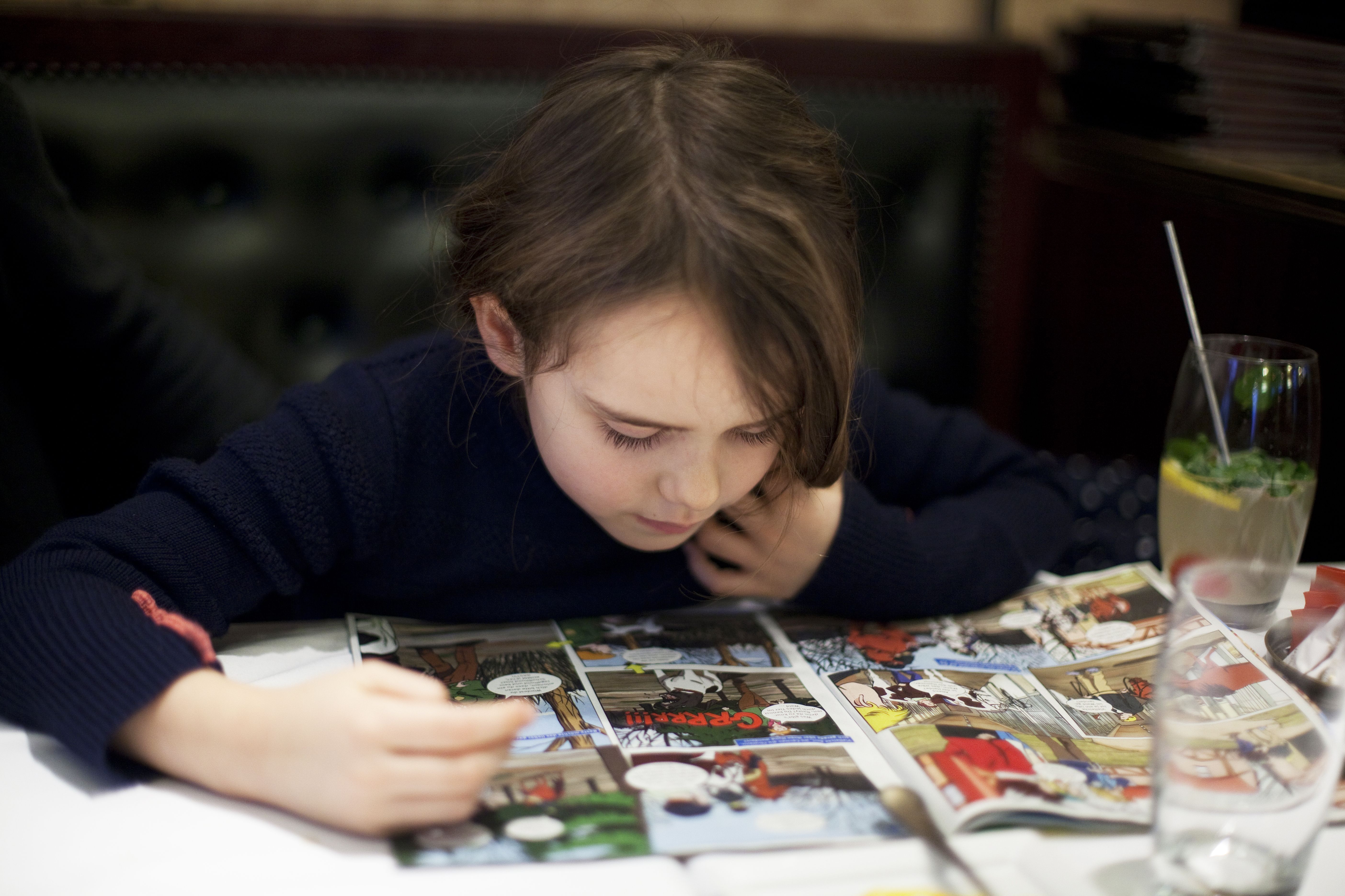 young kid reading an exciting story