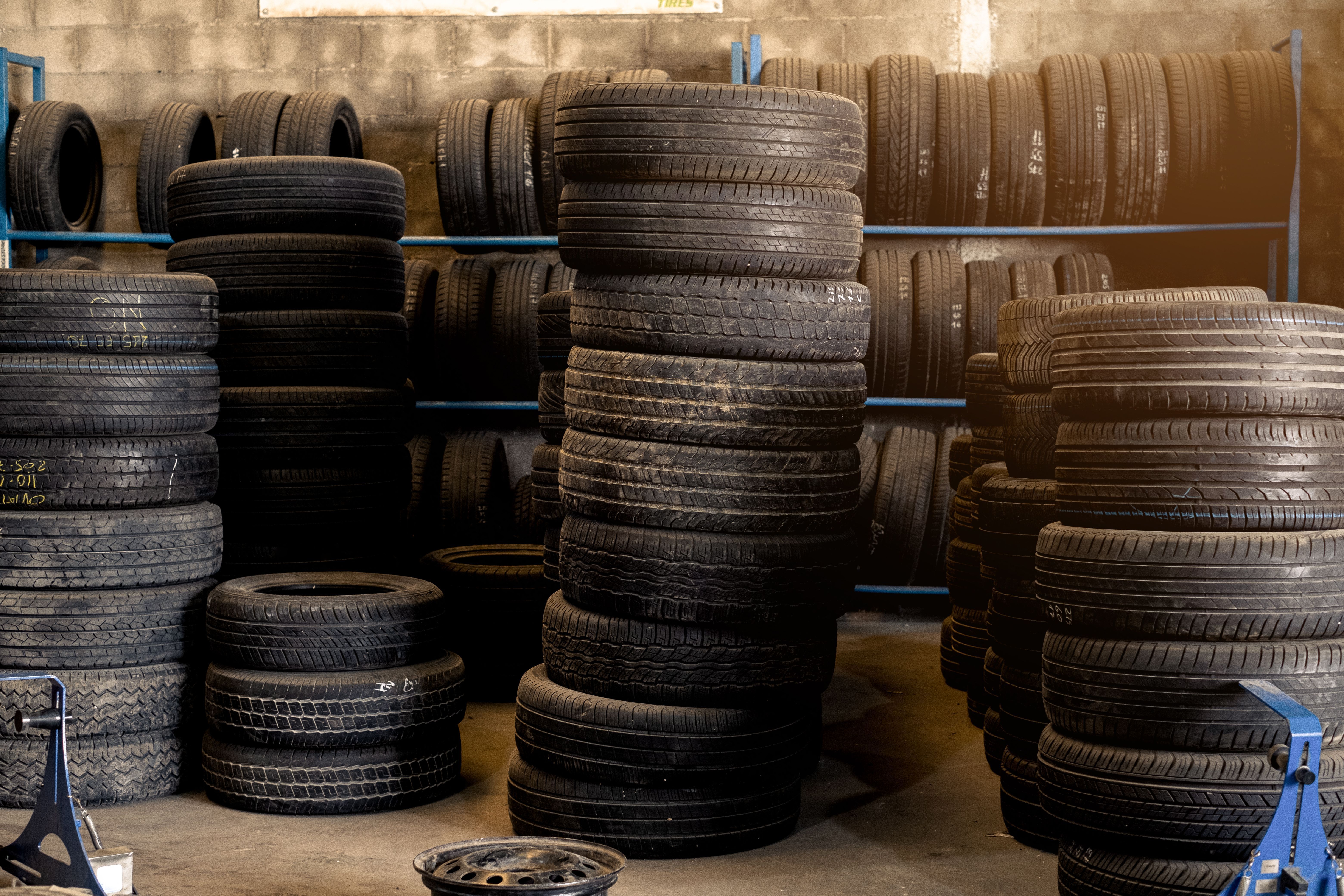 Pile of used tires for recycling in a tire shop.
