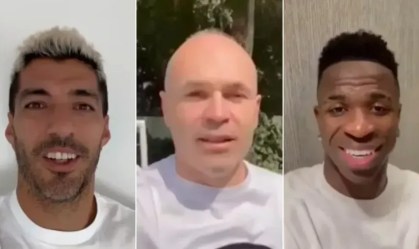 Suárez (esq), Iniesta (centro) e Vini Jr. (dir)