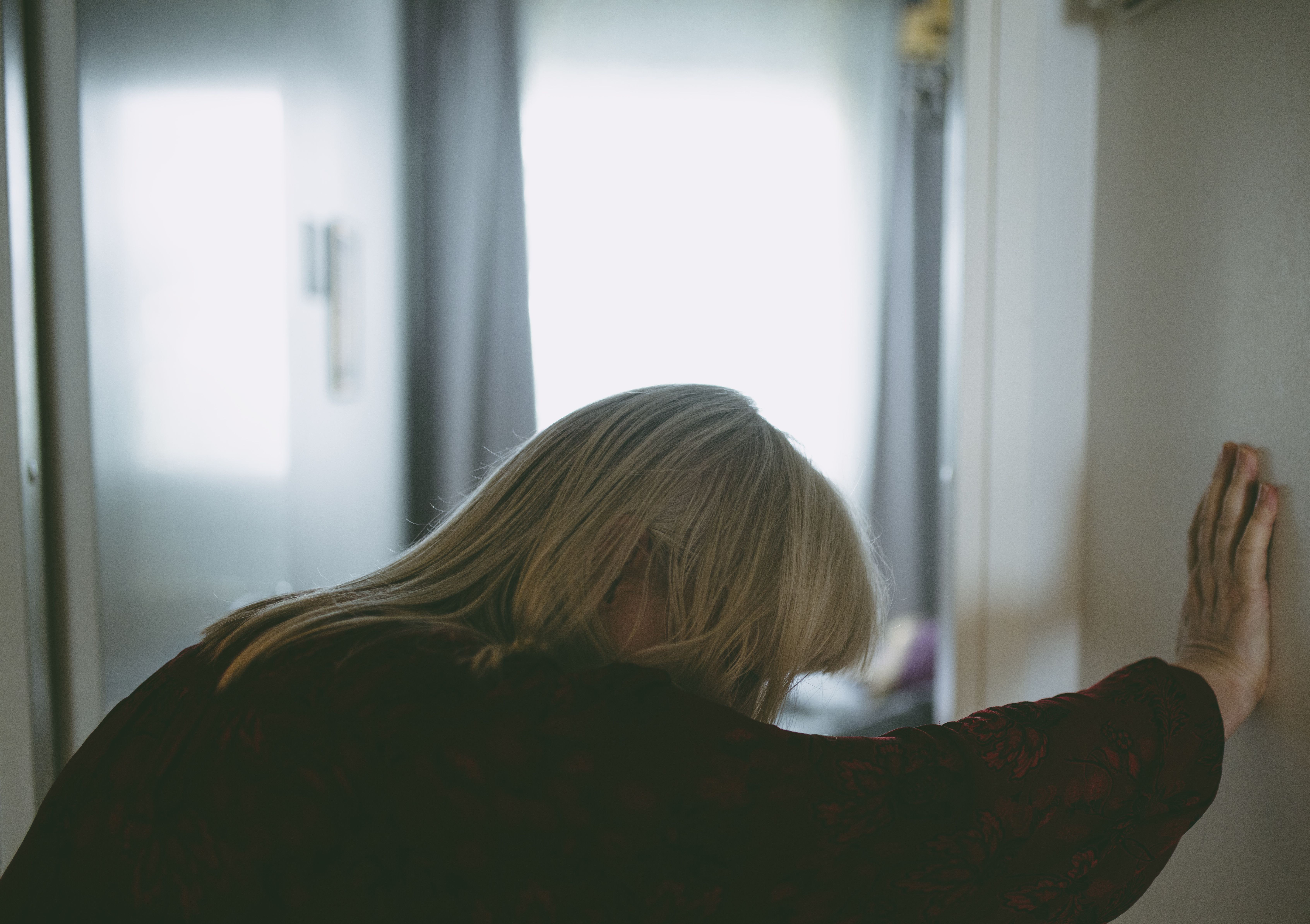 Elderly female suffering dizziness and fatigue at home