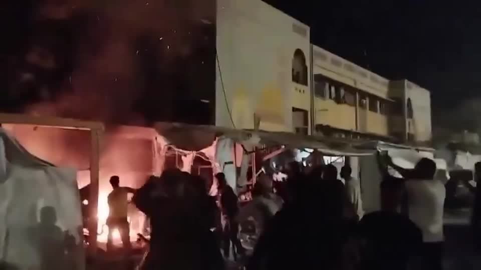 Palestinians douse tent fire after Israeli strike hits Khan Younis killing a journalist, medics say