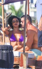 Cauã Reymond e Bella Campos filmam cena de &quot;Vale Tudo&quot; na praia