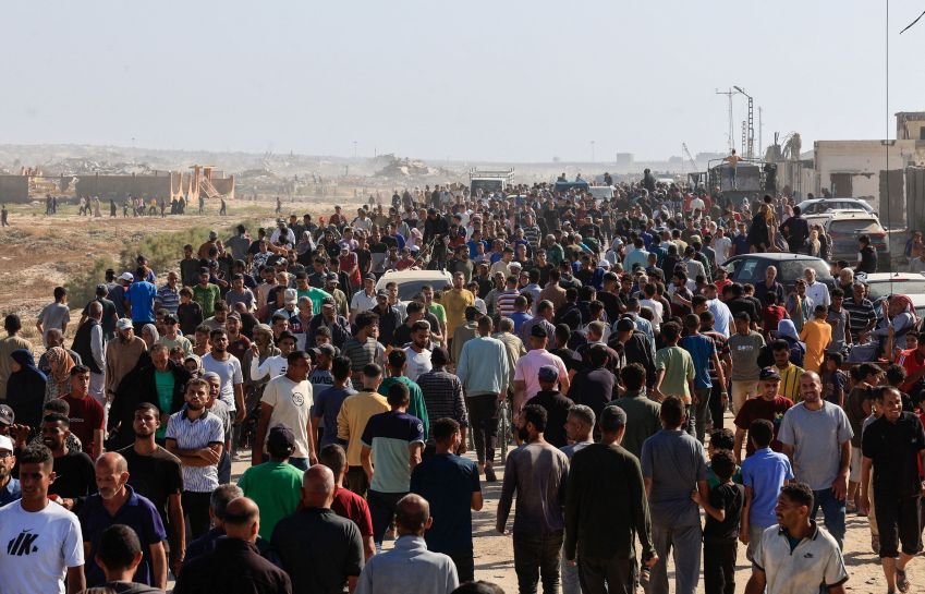Palestinians gather near an aid distribution site administered by the US -backed Gaza Humanitarian Foundation in Rafah • Hatem Khaled/Reuters via CNN Newsource