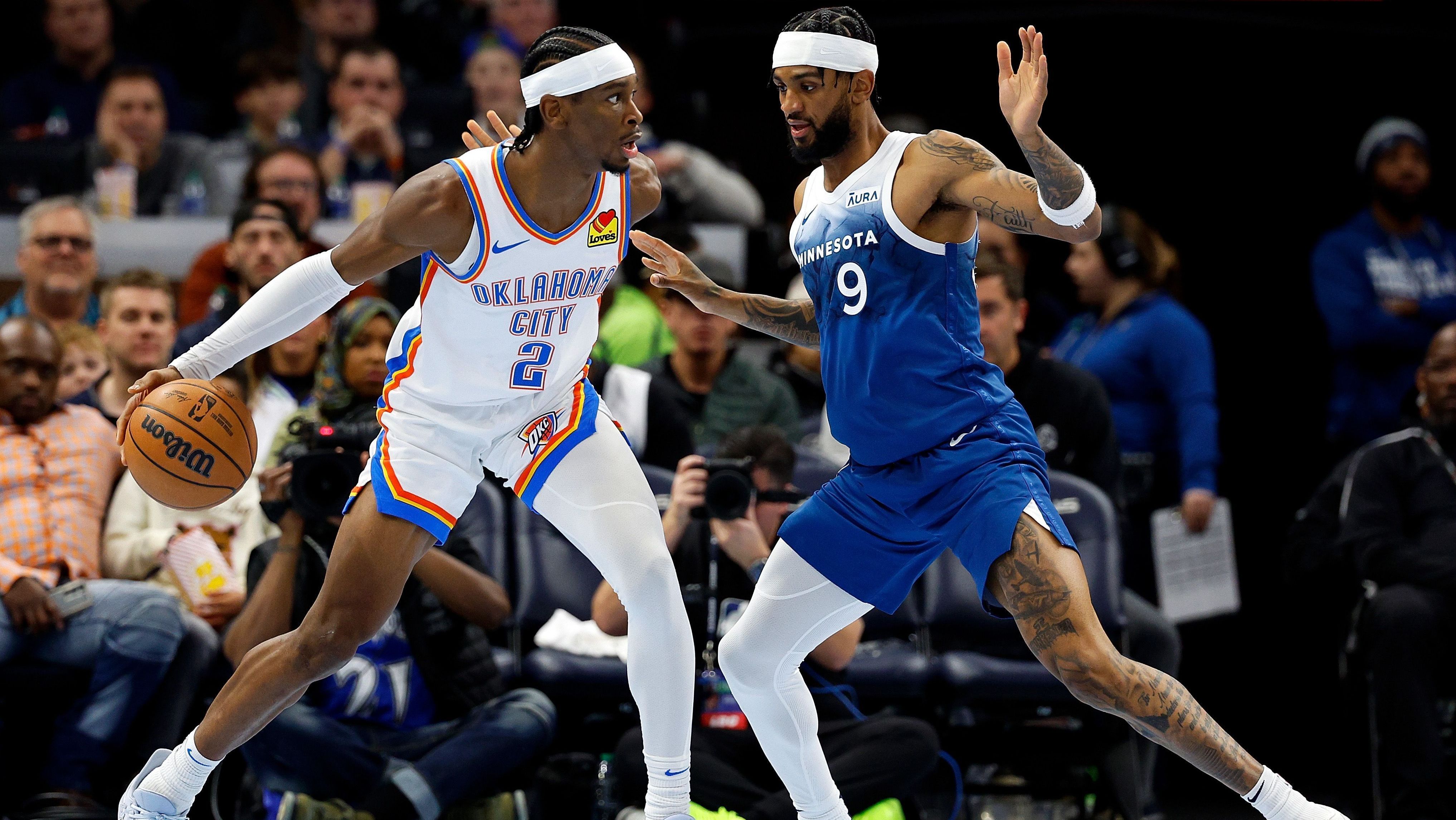 Shai Gilgeous-Alexander e Nickeil Alexander-Walker em partida da NBA