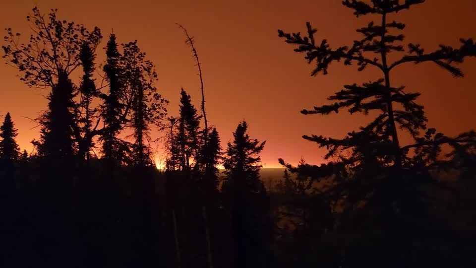 Wildfires paint skies orange in parts of Canada