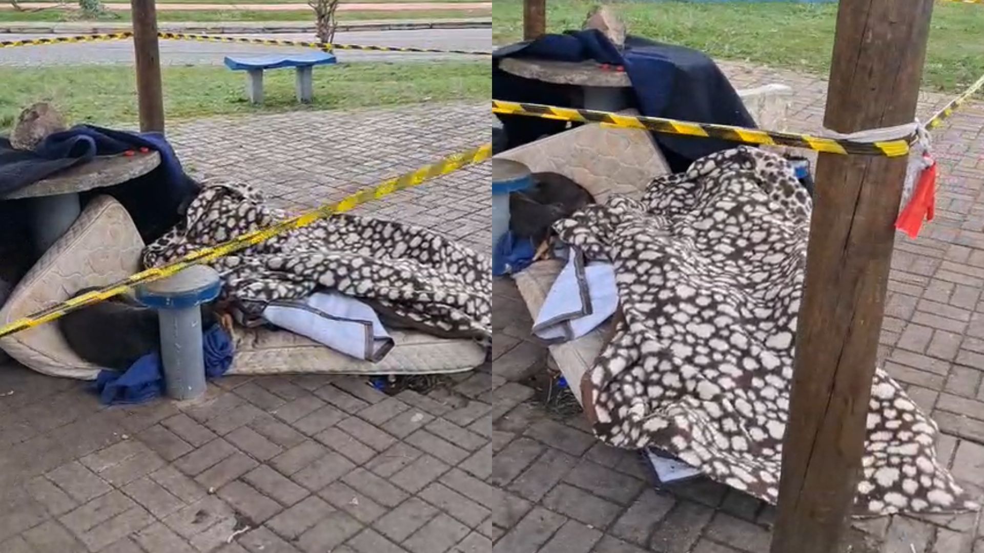 Morador de rua morto coberto com um cobertor e seus pertences em volta