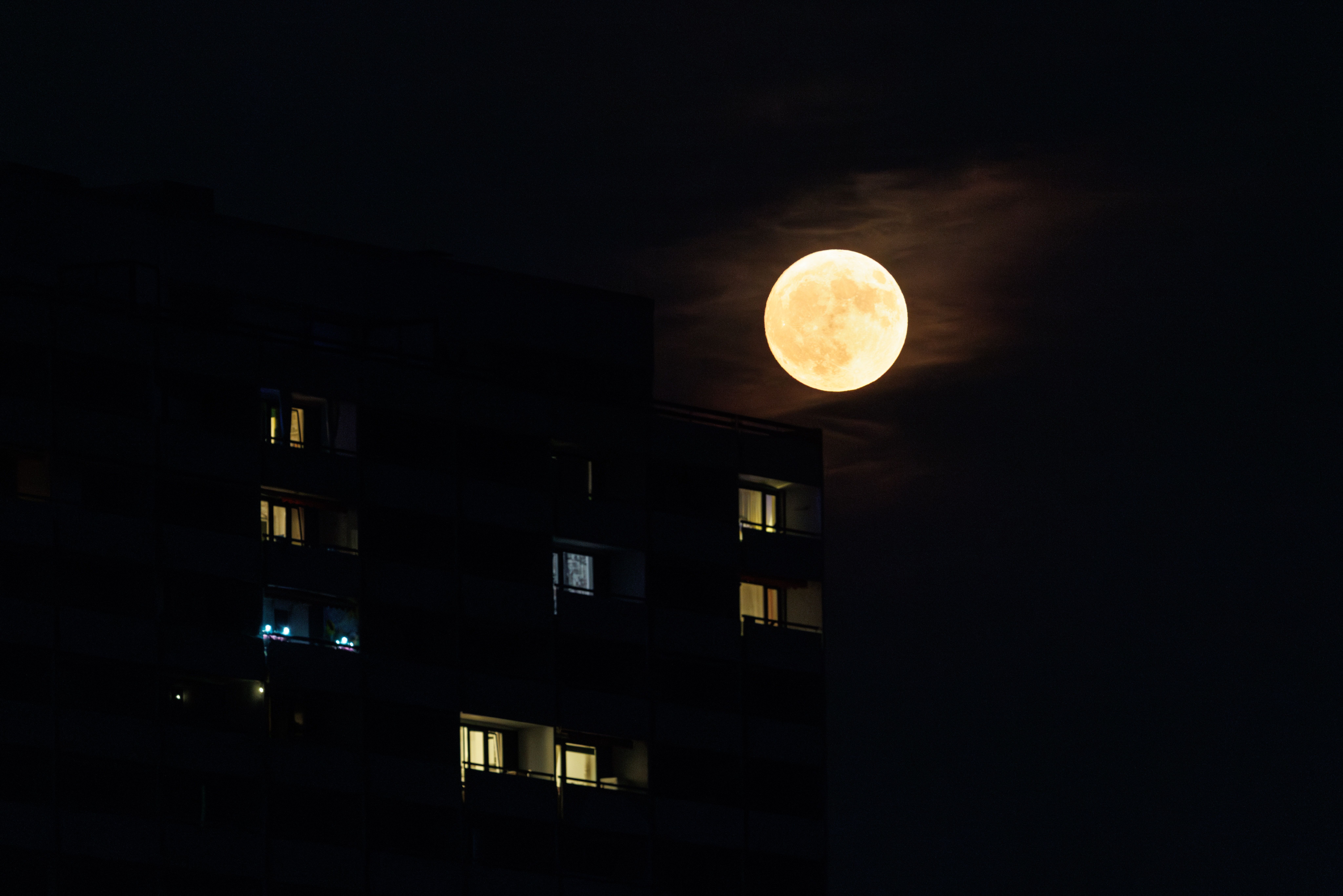 Moonrise in the sky over the city