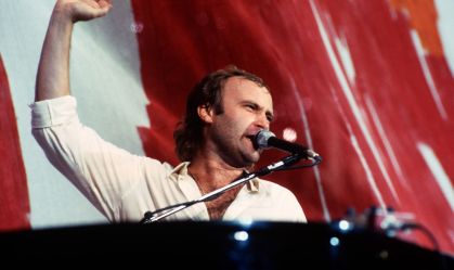 Phil Collins Performs During Live Aid Concert.