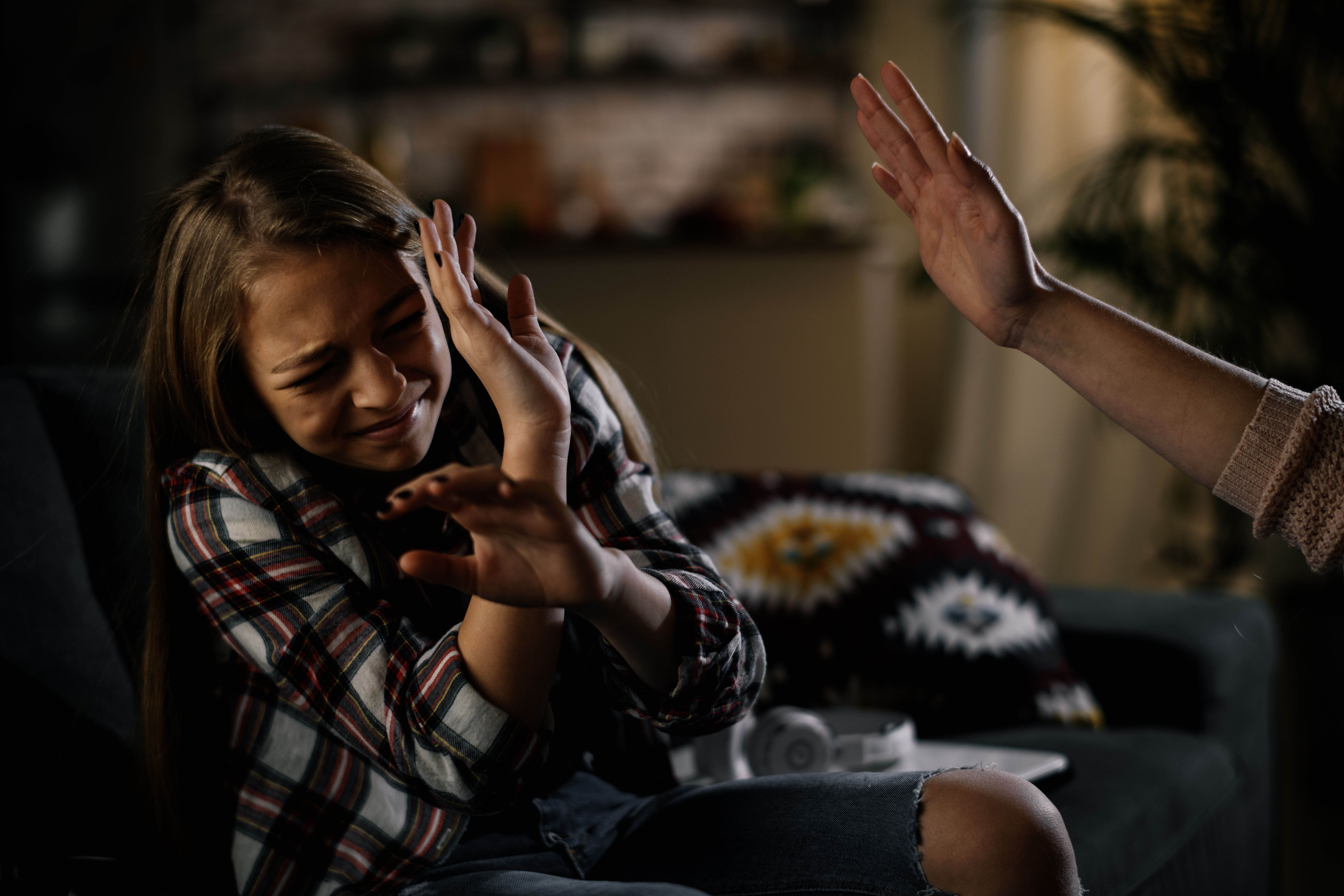 Mother slapping her daughter.