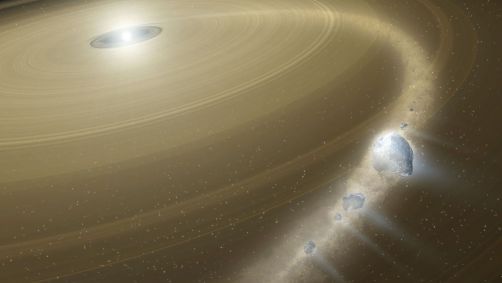 Arte mostra uma anã branca cercada por um grande disco de detritos. Os detritos de pedaços de um objeto capturado, semelhante a Plutão, estão caindo sobre a anã branca