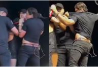 Fã invade palco e dá mordida em Natanzinho Lima; assista