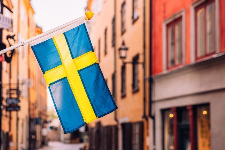 Swedish flag on the streets of Stockholm old town - Gamla Stan, Sweden