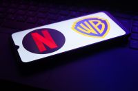 Netflix compra Warner Bros.: é o fim do lançamento de filmes nos cinemas?