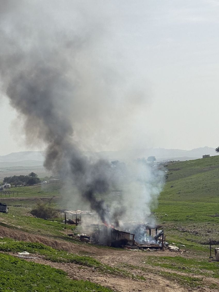 Palestinian Bedouins burn the remains of their homes after being forced to move from Ras Ein al-Auja • Zeena Saifi/CNN via CNN Newsource
