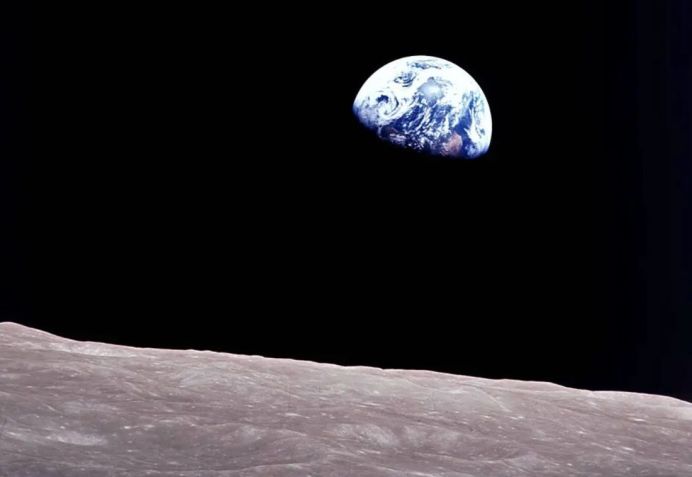 Taken aboard Apollo 8, this iconic photo shows Earth peeking out from behind the lunar surface as the manned spacecraft made history by orbiting the Moon. Artemis II astronauts will have a similar journey, without setting foot on the Moon • William Anders/Nasa