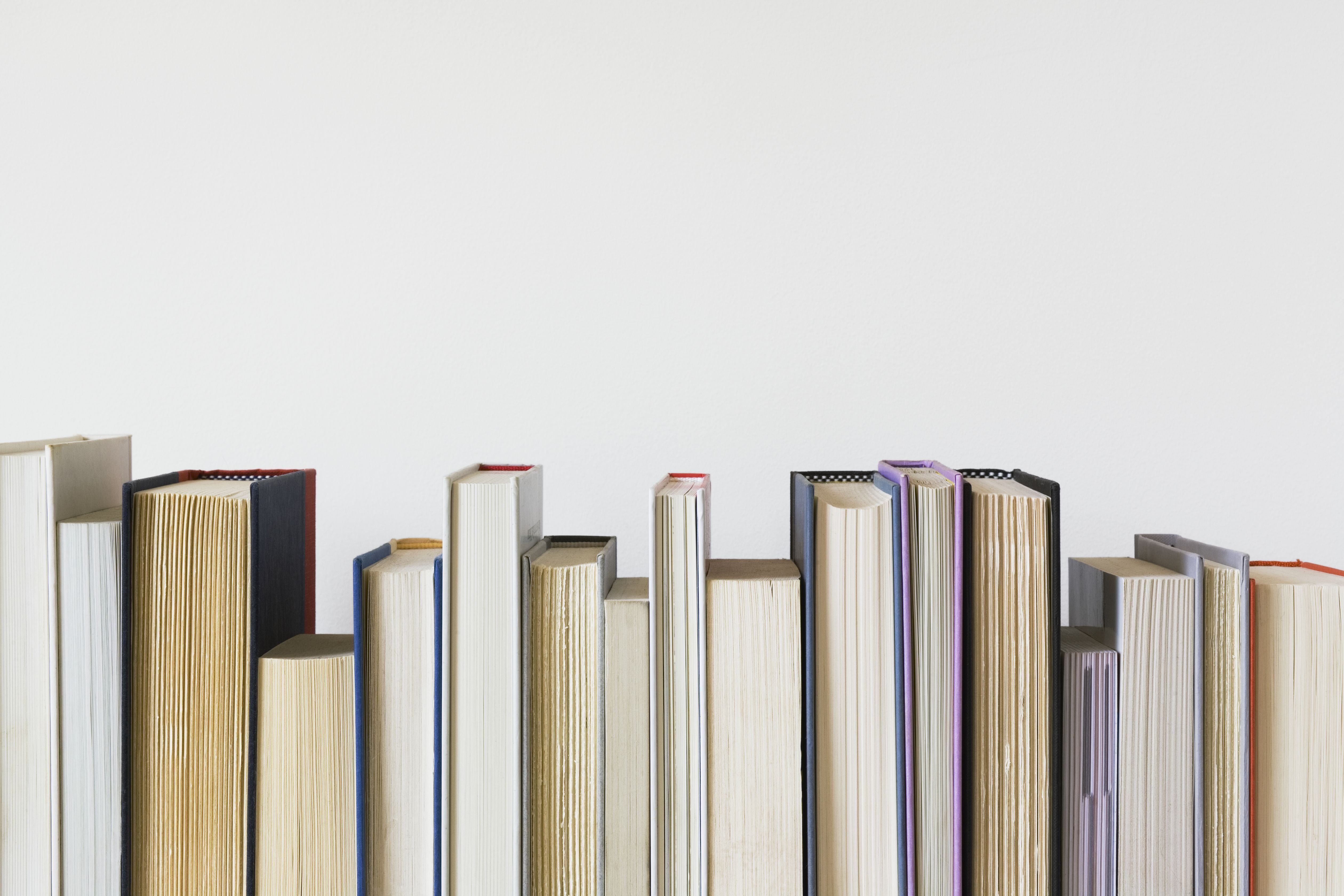 Row of books with various paper colours