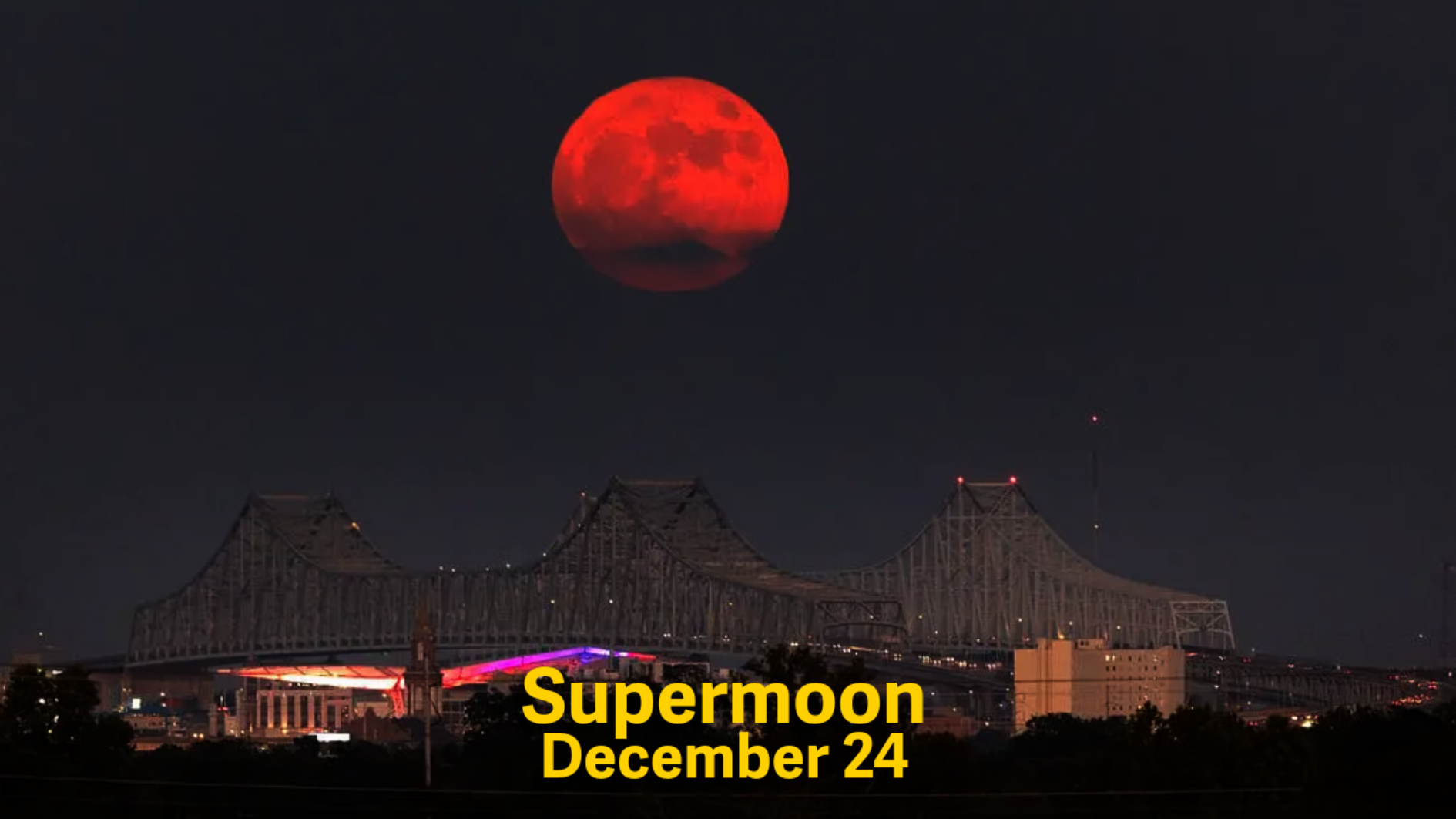 Uma Superlua Azul surge sobre o Rio Mississippi e a Ponte Crescent City Connection em Nova Orleans, em 30 de agosto • NASA/Michael DeMocker