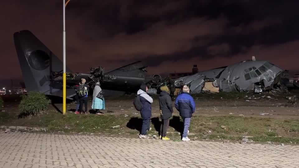 Aftermath of Bolivian cargo plane crash that killed 15 and sparked cash scramble