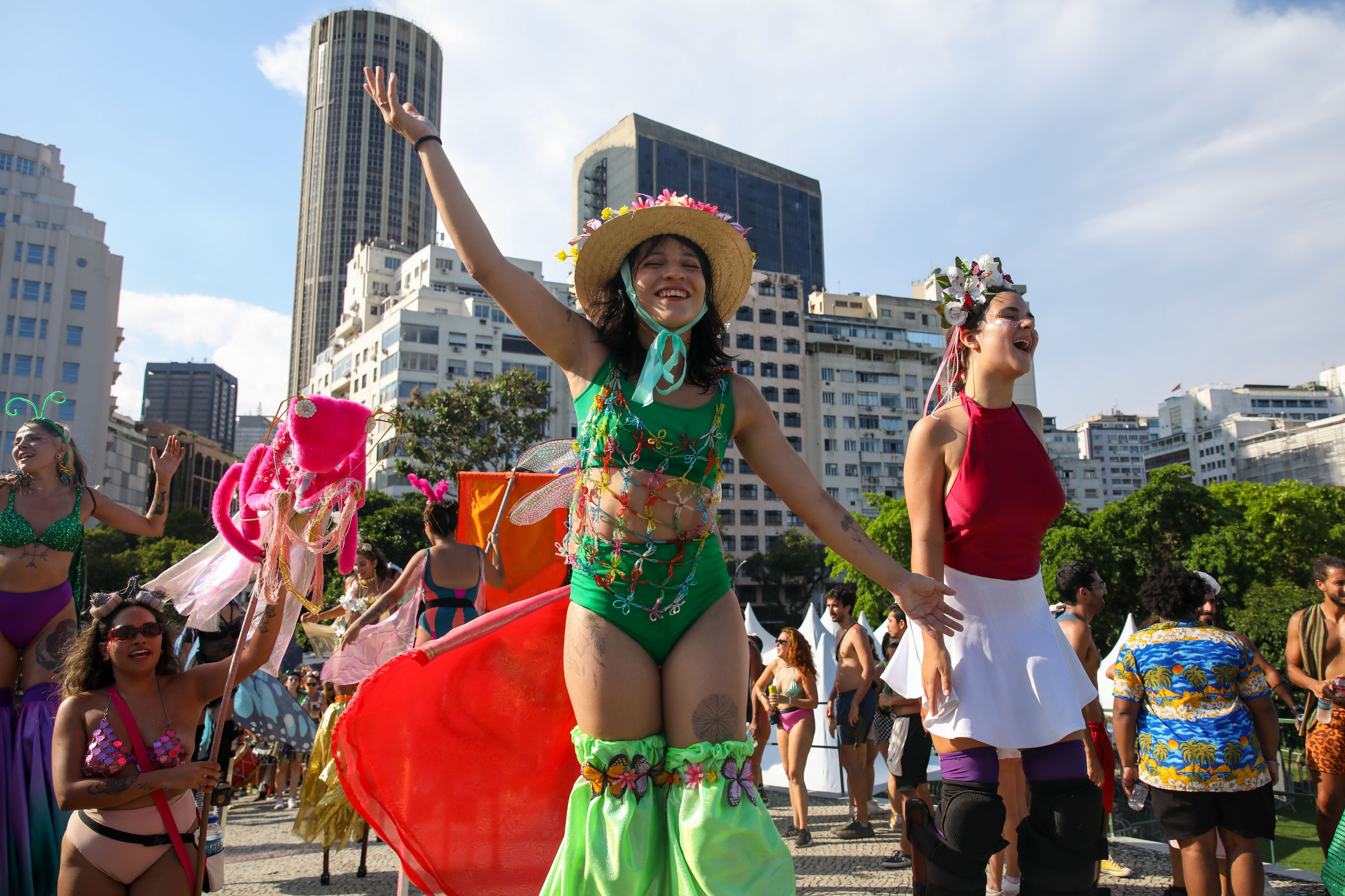 Dancers on stilts dance in a carnival parade in Rio de