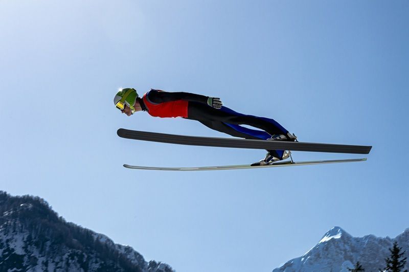 Side View of Male Ski Jumper in Mid-air