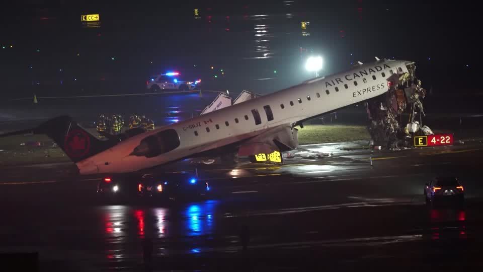 Emergency responders at New York's LaGuardia after jet collides with ground vehicle
