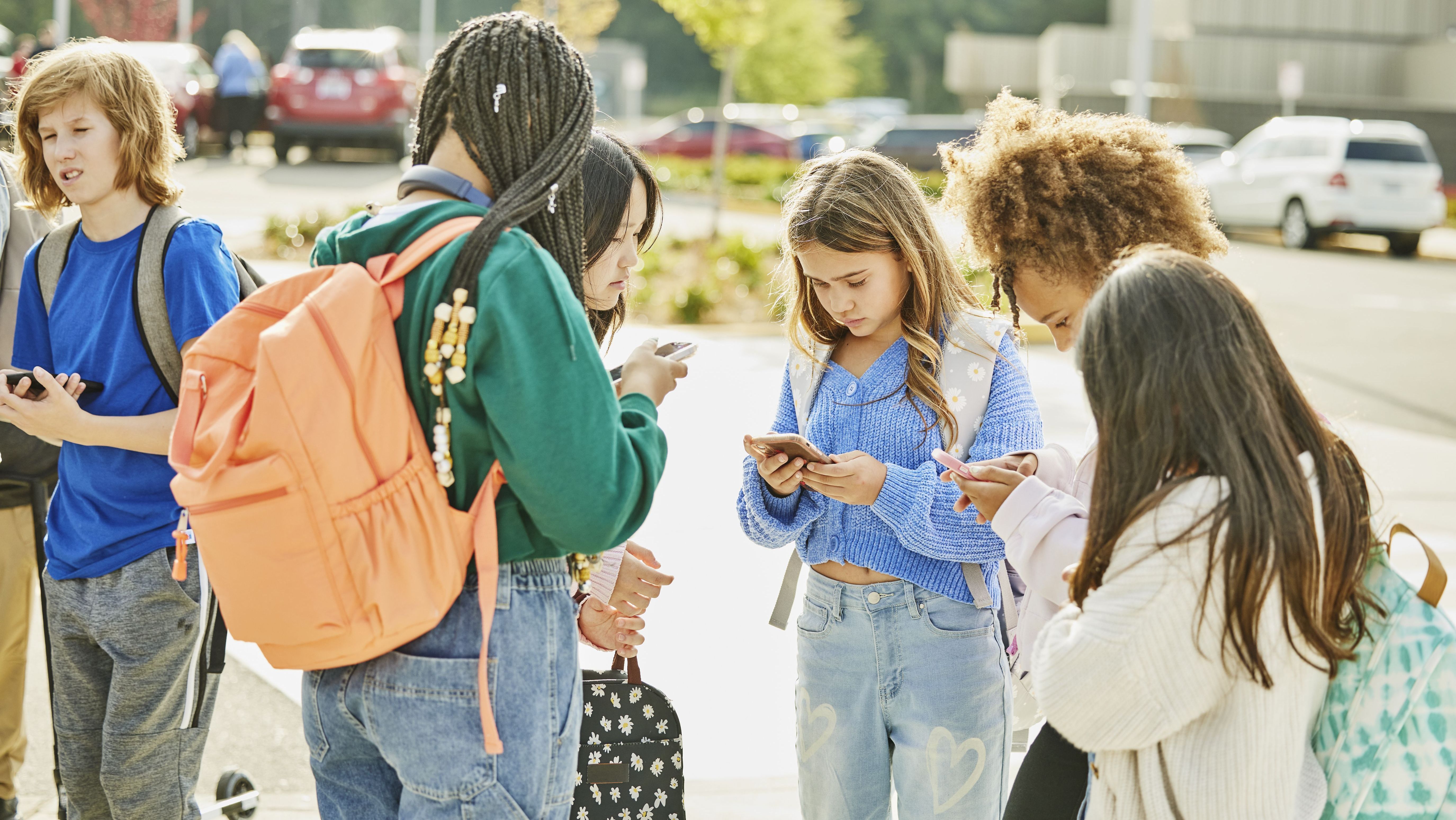 Medium wide shot middle school friends hanging out after school