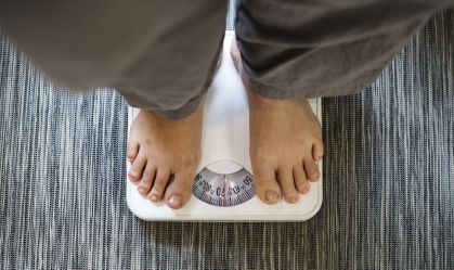 Woman standing on a scale