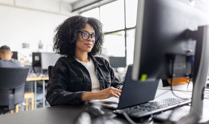 Businesswoman working on computer at her desk in office