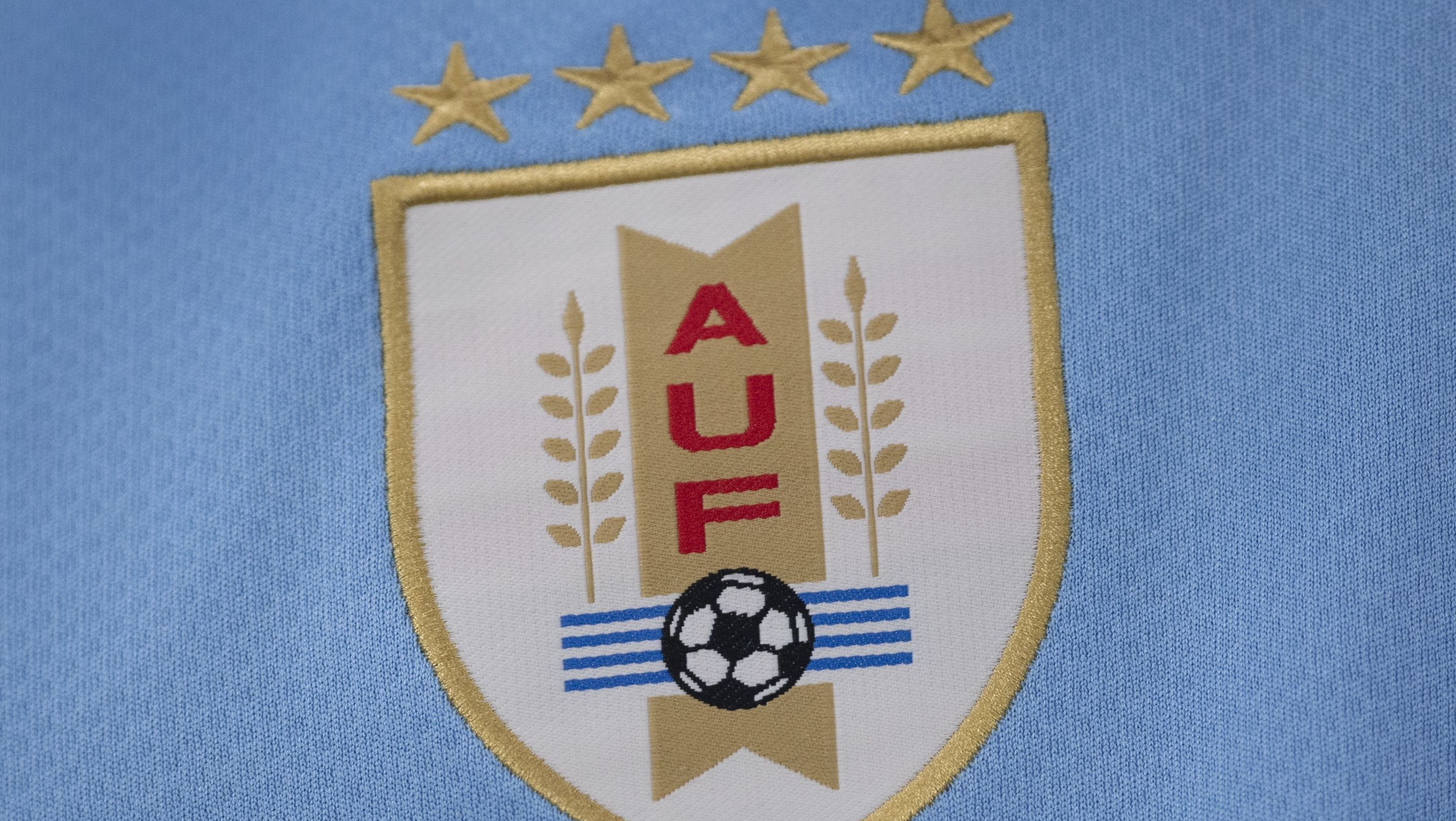 Escudo da seleção do Uruguai com quatro estrelas
