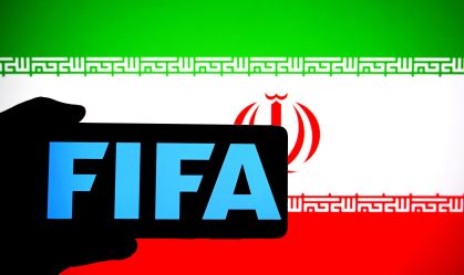 In this photo illustration, a FIFA logo is seen displayed on