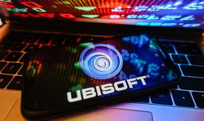In this photo illustration a UbiSoft logo is displayed on a