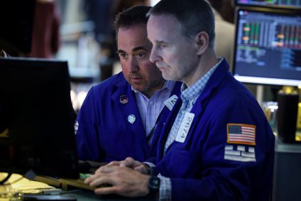 Operadores na bolsa de Nova York em 24 de junho de 2026