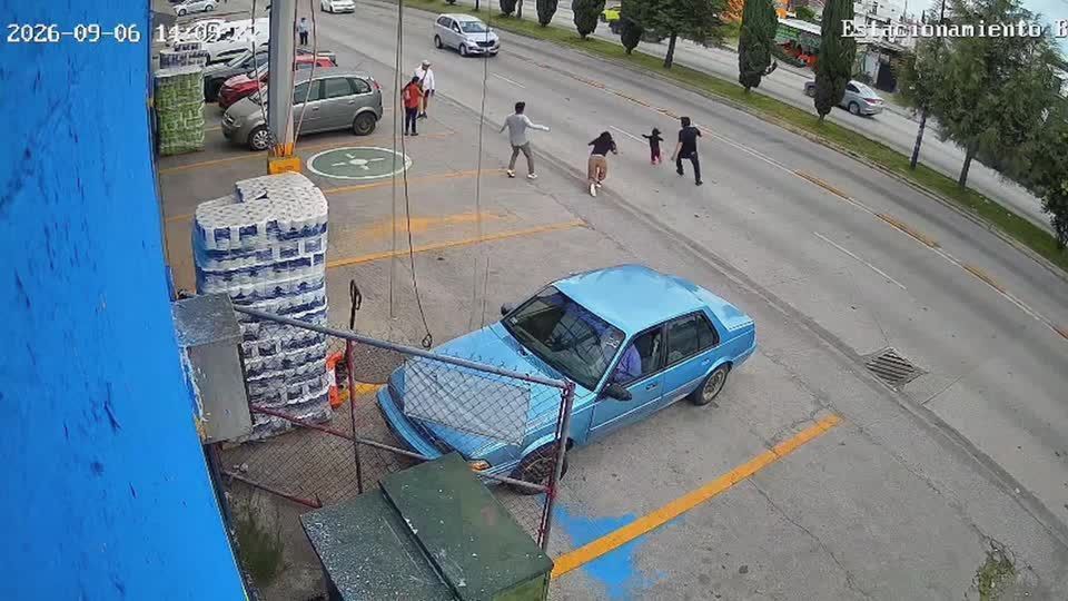 Security camera captures man saving child from moving cars in Mexico
