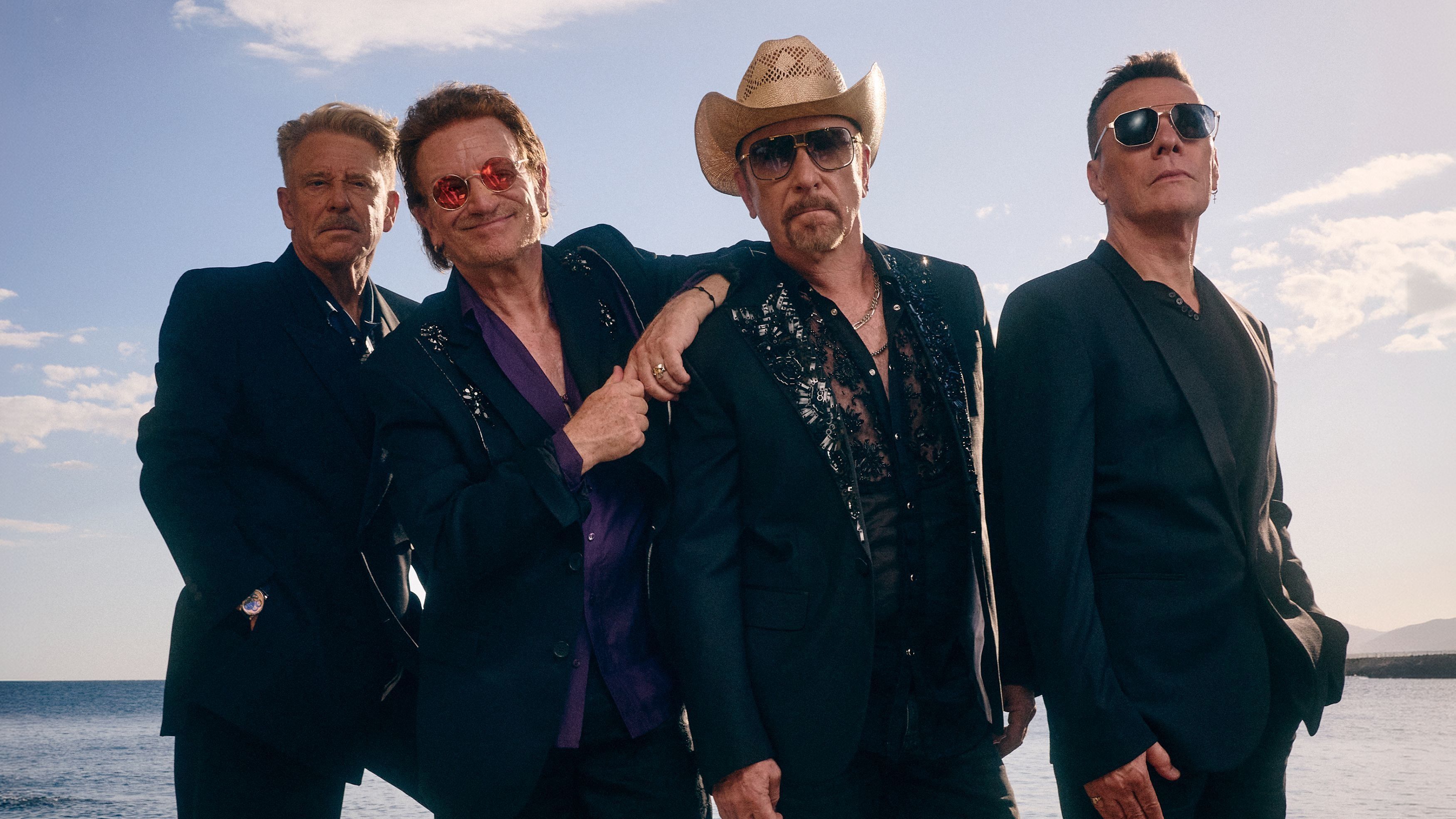 Larry, Bono, The Edge e Adam compõem o U2