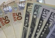 Dólar abre próximo da estabilidade com novos dados de inflação nos EUA em foco