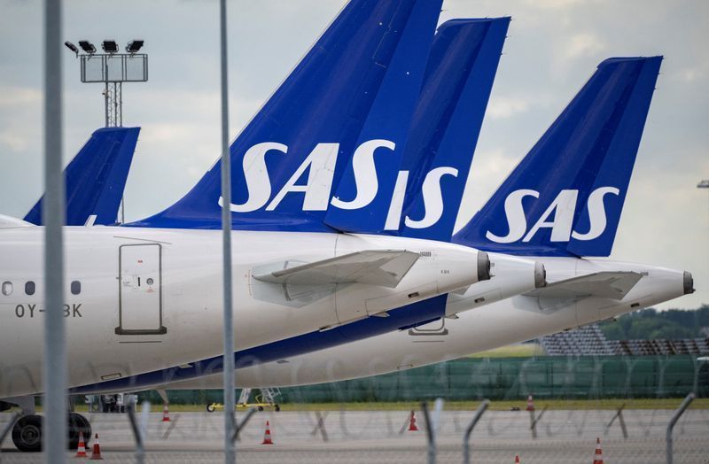 Aviões da companhia aérea SAS no aeroporto de Kastrup, na