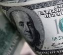Dólar ronda estabilidade na abertura com ameaças tarifárias e dados em foco